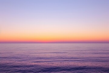 Obraz premium Twilight glow paints the horizon with soft hues of orange and purple, with a minimal, simple background of a clear sky.
