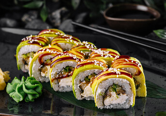 Exquisite sushi roll with mango topping