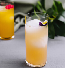 Refreshing summer cocktail with edible flower garnish