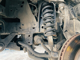 Front shock absorber of pickup truck Car undercarriage that has been heavily used