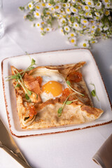 Crepe with Creamy Filling, Cheese, Spinach, Egg and Red Caviar, Gourmet Breakfast