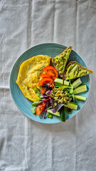 continental breakfast, omelet, vegetables and toast, no people, top view