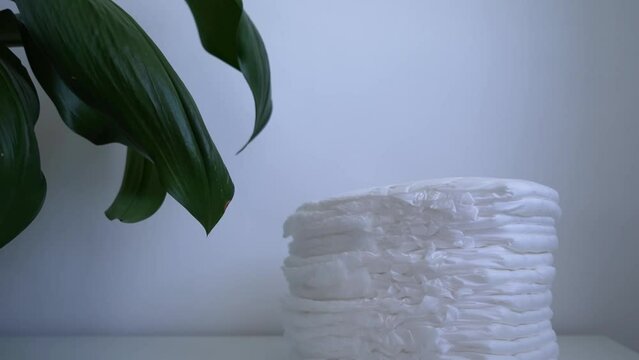 Stack of diapers on white background. Diaper panties for babies