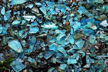Background, texture of fragments of broken bottles covering the ground in a thick layer