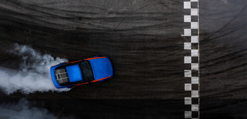 Aerial top view car drifting diffusion race drift car with lots of smoke from burning tires on speed track, Professional driver drifting car with lots of white smoke. © Kalyakan