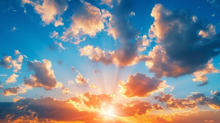 Nature's Canvas: A Stunning Landscape with Blue Sky, White Clouds, and the Orange Sun's Warm Embrace