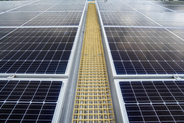 Obraz premium Close-up of blue solar panel landscape installed on the roof of an industrial building to produce green electricity. Sustainable resource storage and renewable energy