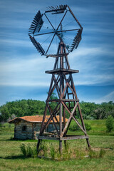 old windmill and log cabin