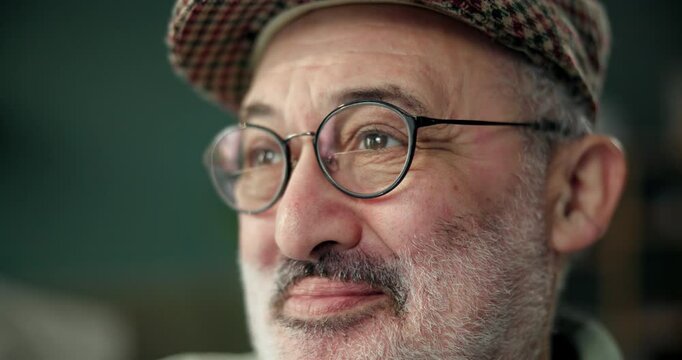 Thinking, face of senior man and memory in nursing home for ideas, peace and nostalgia in living room. Vision, remember and elderly male person with glasses for retirement, wellness and reflection - Powered by Adobe