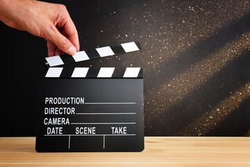 movie clapper on wooden table. Concept of entertainment production