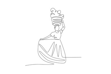 Young woman in traditional dress carries a basket decorated with colorful flowers during Convite