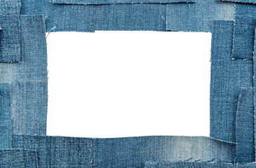 Hole in denim on a white background. Ripped jeans