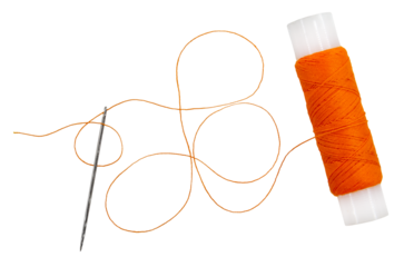 Old spool of thread and needle on a white background. Sewing accessories