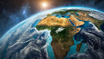 Fototapeta premium A stunning sunrise view from space showcasing the continent of Africa and parts of Europe, with vibrant colors and detailed landscapes, emphasizing natural beauty and grandeur.