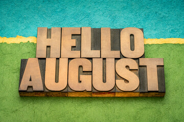 Hello August in vintage letterpress wood type against abstract paper landscape, calendar concept © MarekPhotoDesign.com