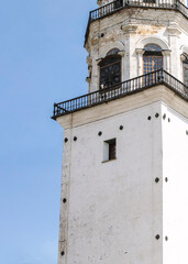 Fragment of an ancient clock tower from the 17th century, vertical image.