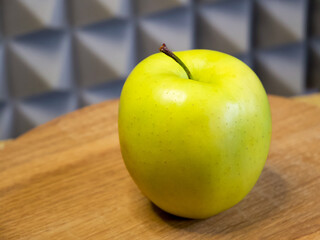 Bright green apple, conveys vitality, fitting for dietary guides or grocery marketing.