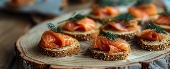 Fototapeta premium Smoked Salmon Canapes With Dill and Black Pepper on Rustic Wooden Board