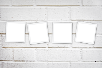 Four instant photo paper square frames on a white brick wall isolated on transparent background, png file