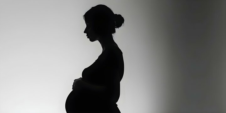 Depicting Pregnancy Depression Through the Black Silhouette of a Sad Pregnant Woman. Concept Maternal Mental Health, Silhouette Photography, Emotional Expressions, Pregnancy Portraits