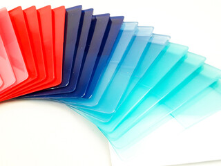 Stack of assorted color chips, isolated on a white background. This is an example of the colors...