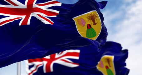 Flags of Turks and Caicos Islands waving in the wind on a clear day