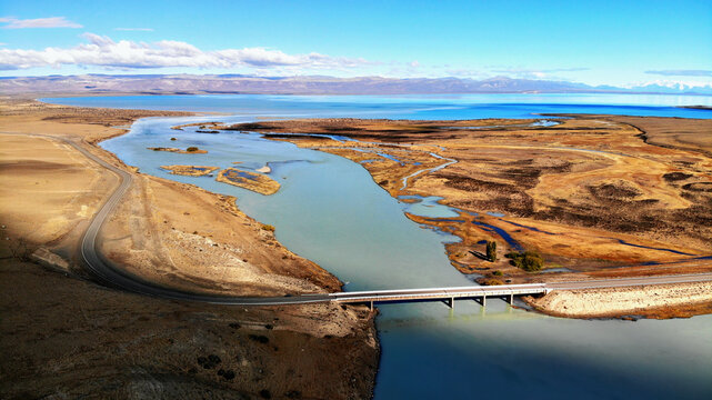 Gridge over a river flowing into a lake in the pampas of southern Argentina