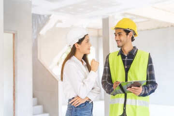 Builder team, foreman asian young engineer, architect man, woman working, discussing construction drawing on clipboard follow project to build industrial plan at house site. Engineering worker people.