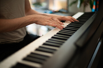 Close-up of Hands Playing an Electric Piano