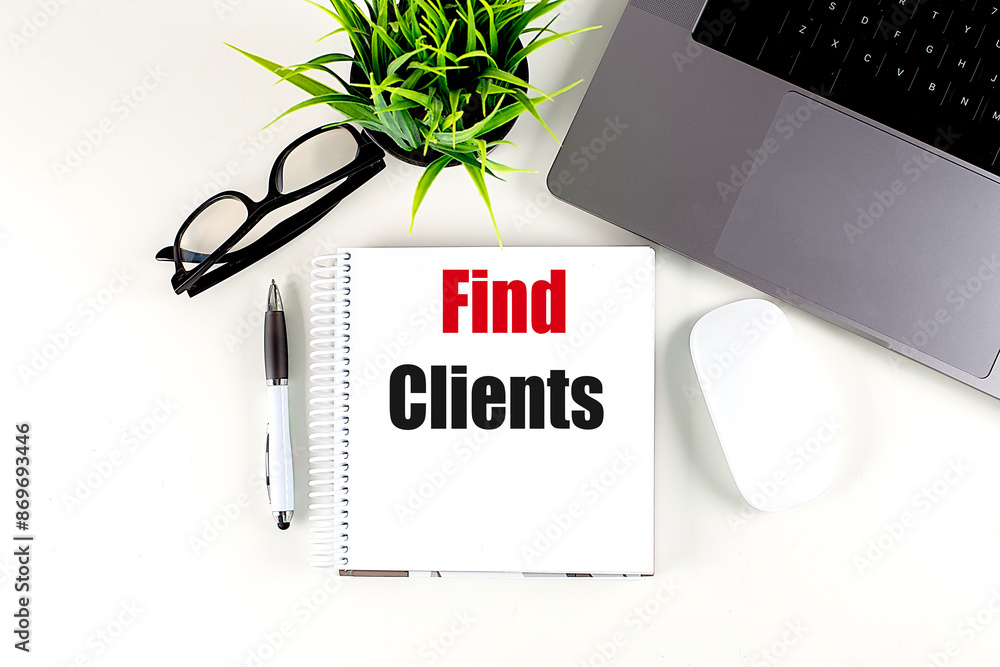 Poster find clients text on notebook with laptop, mouse and pen