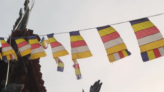 Detail of some Buddhist flags in a Pagoda in Asia. Buddhist religion