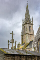 16th Century Calvary in Guehenno Brittany France with Church Spire