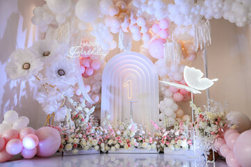 Children's photo zone. Birthday party for 1 year old girl on a background photo wall. Arch...