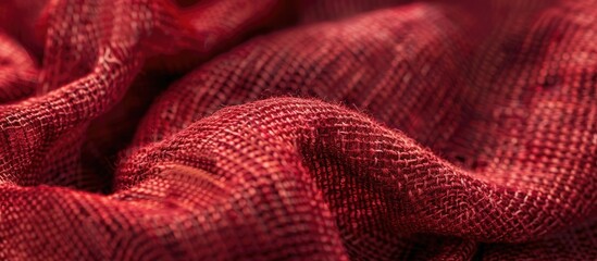 A close-up view showing the texture of a soft, small-fiber fabric in either red or dark red, with copy space image.