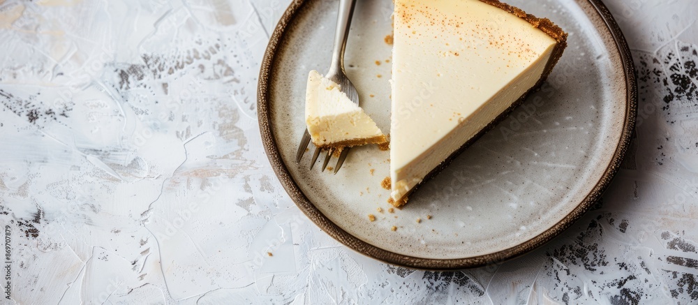 Poster A plate with a slice of cheesecake, a fork, on a light background with copy space image.