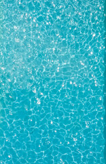 Aerial view of a blue atter sparkling in a swimming pool  A lot of negative space is in the image