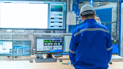 Engineer working at control room,Manager control system,Technician man monitoring program from a...