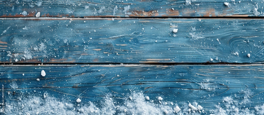 Aufkleber Christmas-themed background featuring blue wooden texture with snow, ideal for adding text or images in the copy space image.
