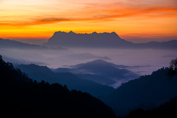 Doi Luang Chiang Dao misty mountain landscape at morning in cloudy sunrise sky 
