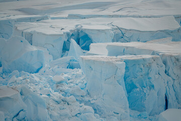 Nature Wallpaper Iceberg Snow Antarctica Frozen Ice Breaking Up Edge to Edge Detailed Close Up Texture. White and Blue Colors. Climate Change Warming