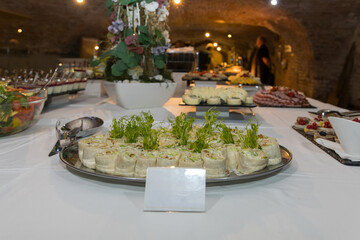 Banquet table at the celebration. Prepared food on the tables.