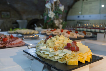 Banquet table at the celebration. Prepared food on the tables.