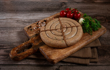 raw spiral sausages, on a wooden board, top view, no people,