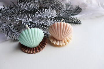 Christmas time. handmade Christmas candles made of natural soy wax and fir branches with Christmas tree decorations