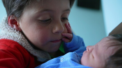 Tender moment between an older sibling and newborn baby, capturing a close and loving bond, where the baby gently touches the sibling's face, highlighting the beauty of familial love