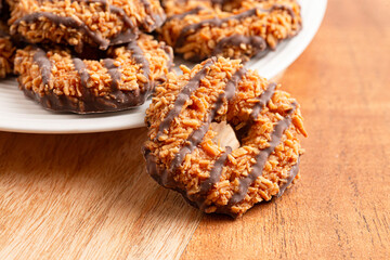 Sweet and Sticky Coconut Caramel Fudge Striped Cookies on a Wooden Table