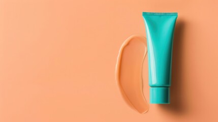 A turquoise hand cream tube presented on a soft peach background, offering a fresh and inviting look for a hydrating skincare product