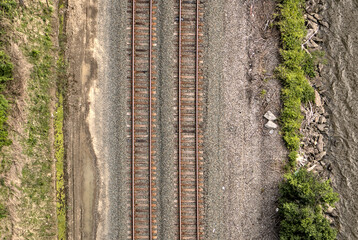 view of train tracks next to river from kingston rhinebeck bridge in hudson valley (railroad line...
