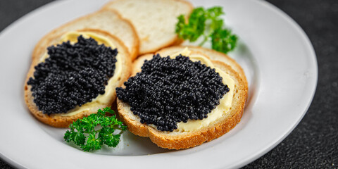 lumpfish caviar seafood black caviar natural fresh appetizer meal food snack on the table copy...