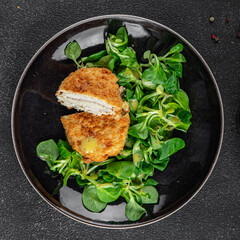 cutlet cordon bleu chicken meat, ham, cheese natural fresh appetizer meal food snack on the table copy space food background rustic top view